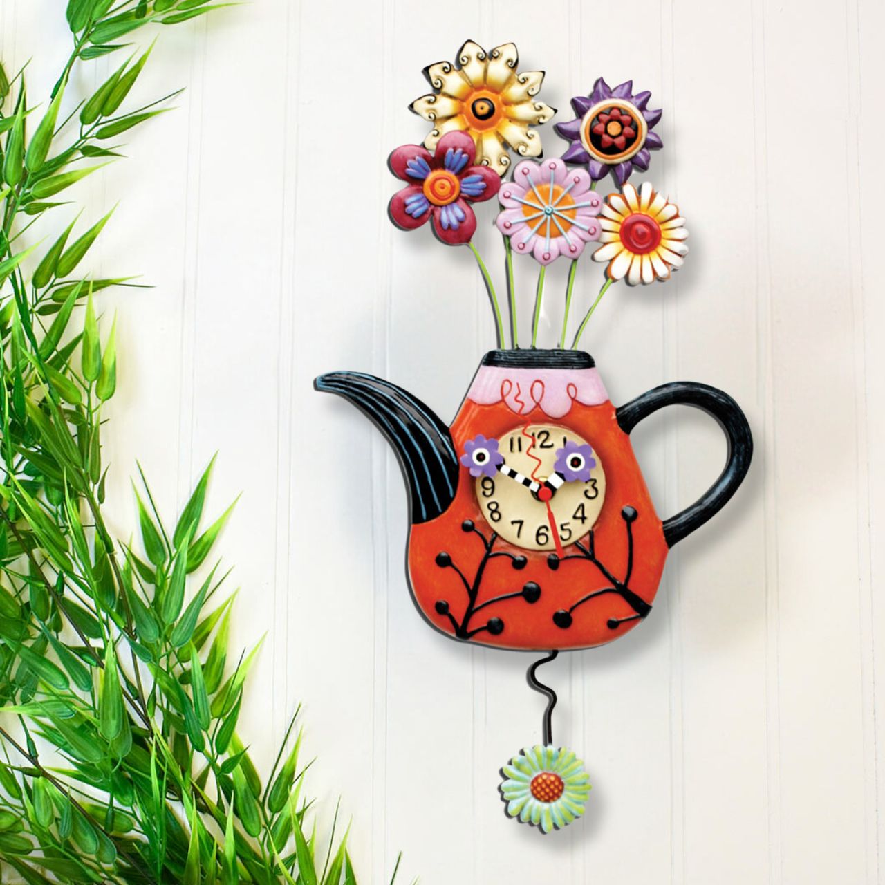 The Allen Designs collection of unique, handcrafted clocks adds a contemporary and artistic touch to every home. This whimsical wall mounted clock is designed by Michelle Allen, made from resin and then painted in the fresh colour palette with hand painted clock hands and swinging pendulum. 