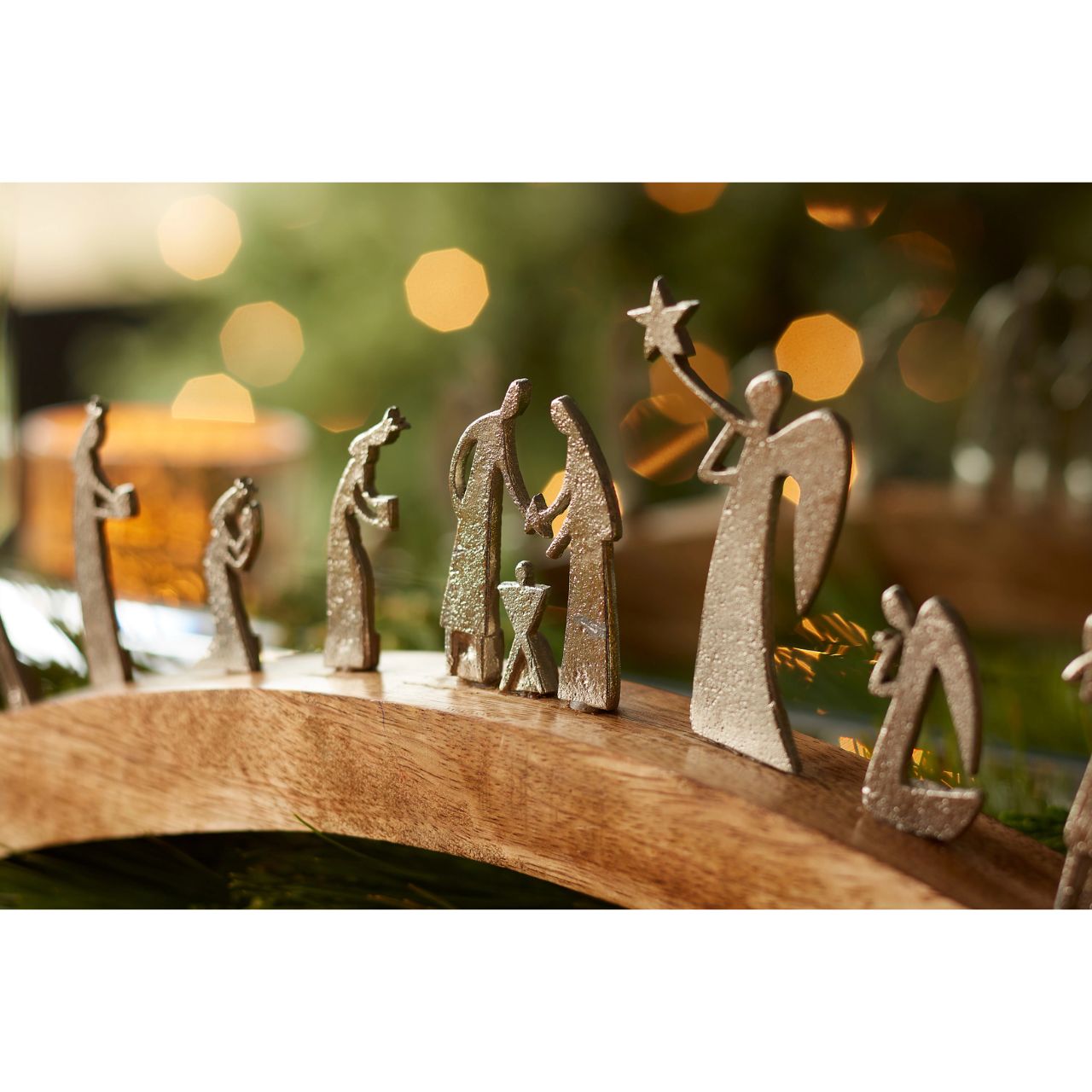 Artist, Wendy Wiinanen, crafts memorable moments of intrigue from mango wood and aluminium. This enchanting arch display showcases the characters of the traditional Nativity scene with simplistic elegance.