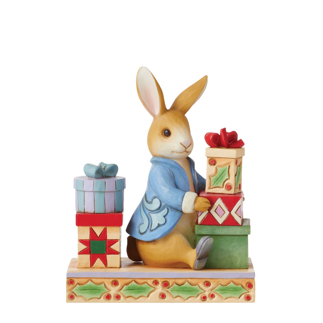 Beatrix Potter Peter with Presents Figurine by Jim Shore  2022 celebrates Peter Rabbit's 120th anniversary. Jim Shore celebrates Beatrix Potter's lovable cast of characters with charming craftsmanship. This endearing figurine features the esteemed Peter Rabbit on Christmas day surrounded by handsomely packaged presents.