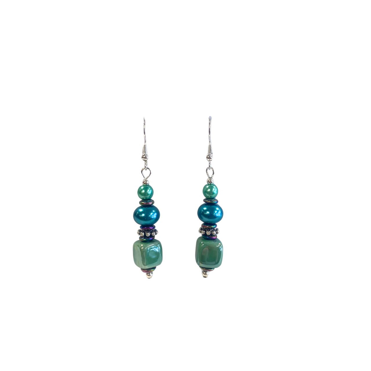 These attractive earrings combine handmade Ceramic Cubes in seagreen with turquoise Pearl Rondelles, tiny iridescent Hematite gemstone rondelles with decorative silver toned elements. Nickel free.