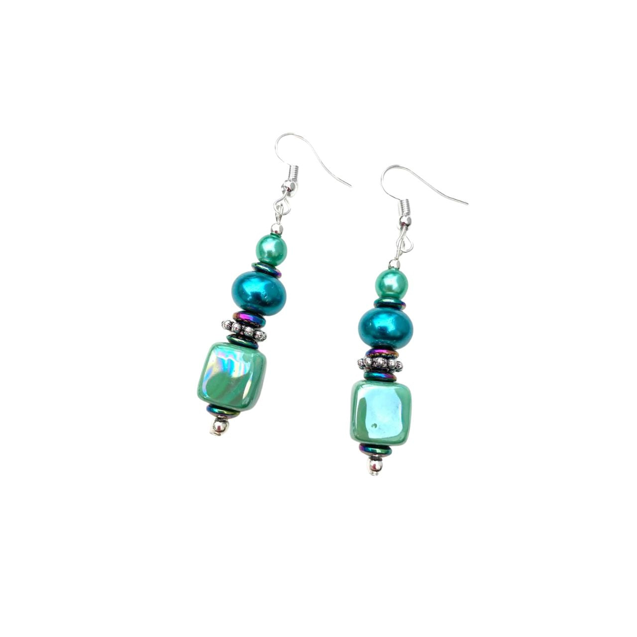 These attractive earrings combine handmade Ceramic Cubes in seagreen with turquoise Pearl Rondelles, tiny iridescent Hematite gemstone rondelles with decorative silver toned elements. Nickel free.