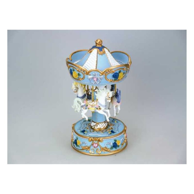 Light blue carousel decorated with yellow and blue roses and rose rhinestones turns to the melody Blue Danube.