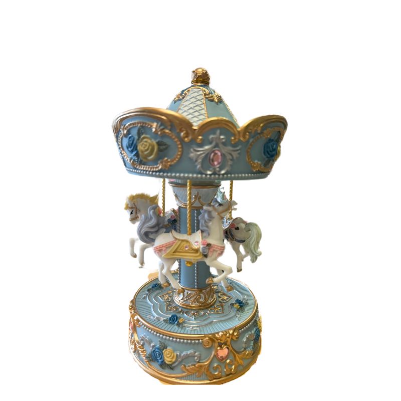 Light blue carousel decorated with yellow and blue roses and rose rhinestones turns to the melody Blue Danube.