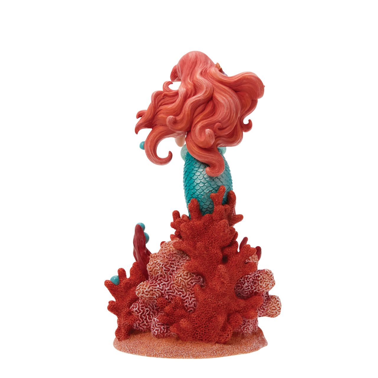 Ariel joins the Disney Showcase Botanical collection in honour of the film's 35th Anniversary featuring sea florals and coral (which is the 35th Anniversary gift). Ariel holds a small Sabastian in her delicate hands as she listens intently to his story. A vibrant base of coral, sand and rising bubbles encapsulates the underwater princess.