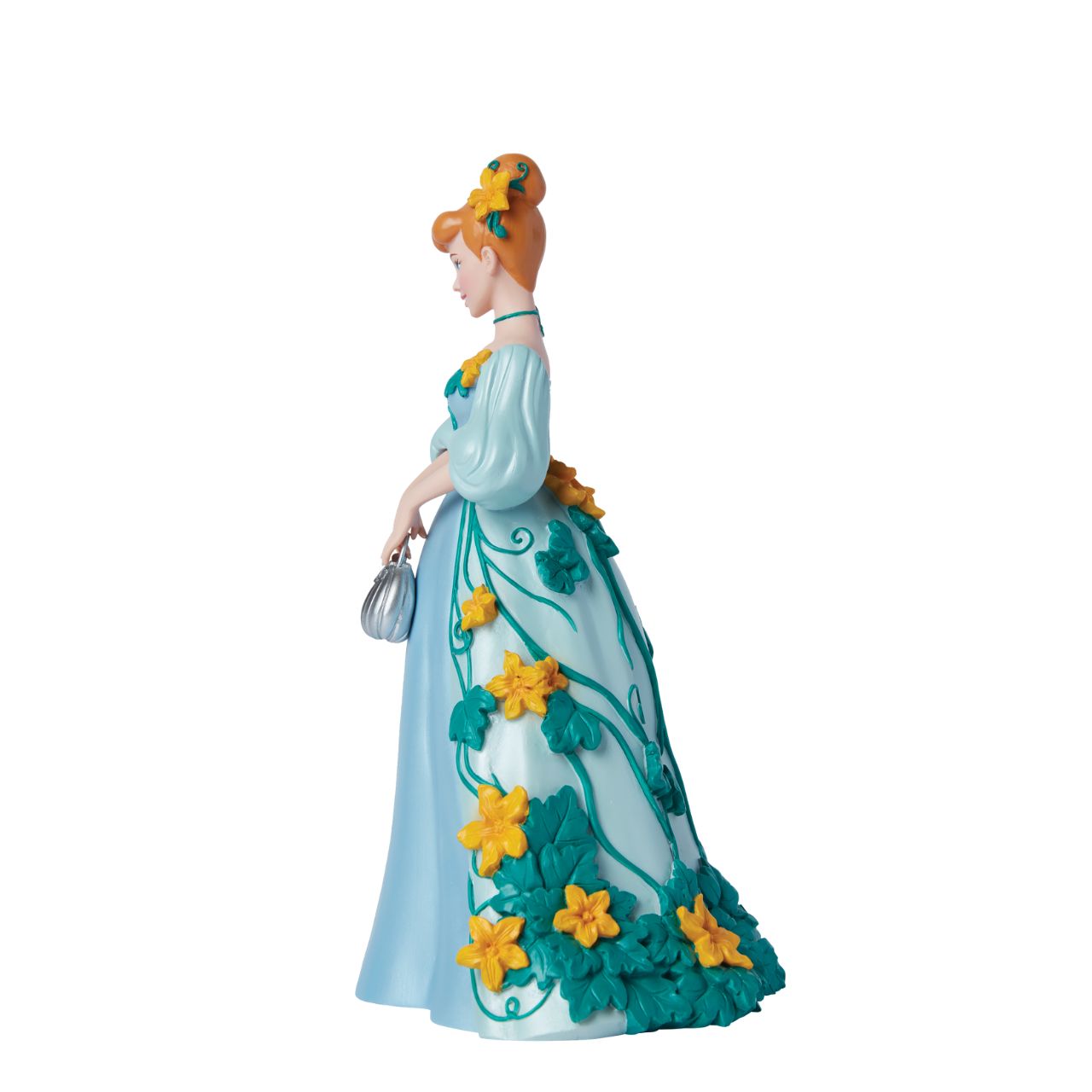 Part of the Disney Showcase Botanical collection, the Botanical Cinderella figurine sees Disney's iconic princess in her trademark blue ball gown adorned with bright yellow flowers and swirling green vines. Holding her silver pumpkin shaped handbag, she's ready to meet her Prince Charming.