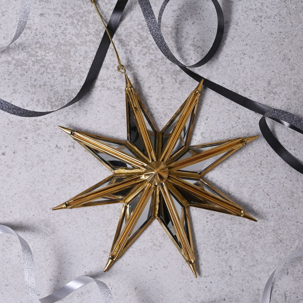 Celestial Gold Mirror Star Tree Decoration Large  A gold mirror star tree decoration by THE SEASONAL GIFT CO.  This gorgeous decoration will stand out amongst the branches on the Christmas tree.