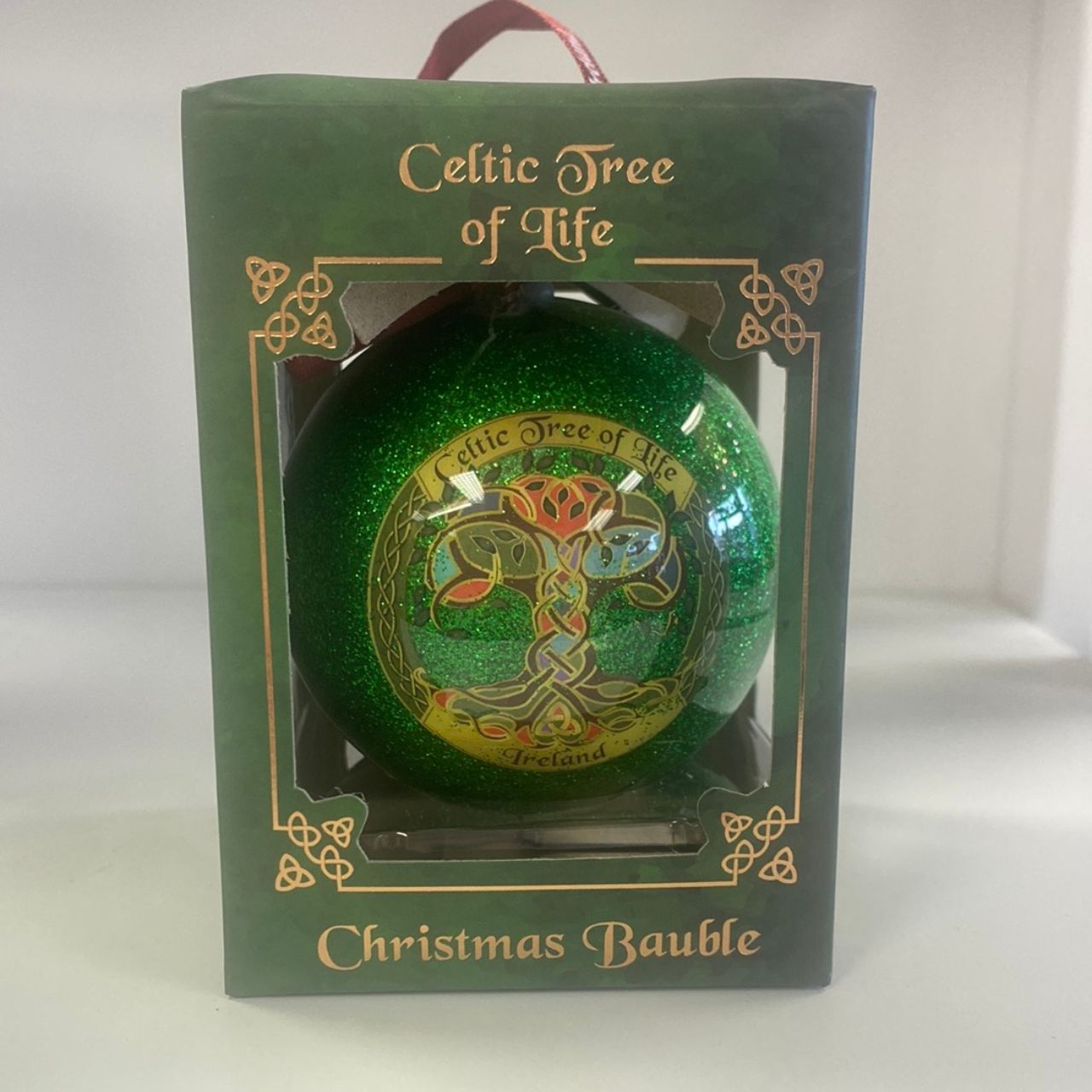 This Celtic-inspired Tree Of Life Christmas Bauble is a must-have for any holiday décor. Made from durable materials, this ornament features intricate detailing and a beautiful design. Celebrate the season with this unique and meaningful addition to your Christmas tree.