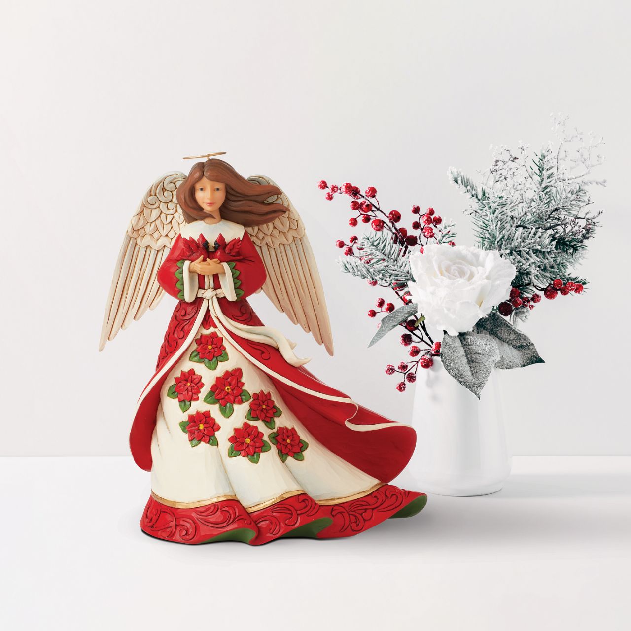 Heartwood Creek Christmas Angel Figurine  Celebrate Christmas this year with this beautiful Heartwood Creek collection figurine by Jim Shore. This beautiful hand crafted and hand painted Christmas Angel figurine would look beautiful in any home.