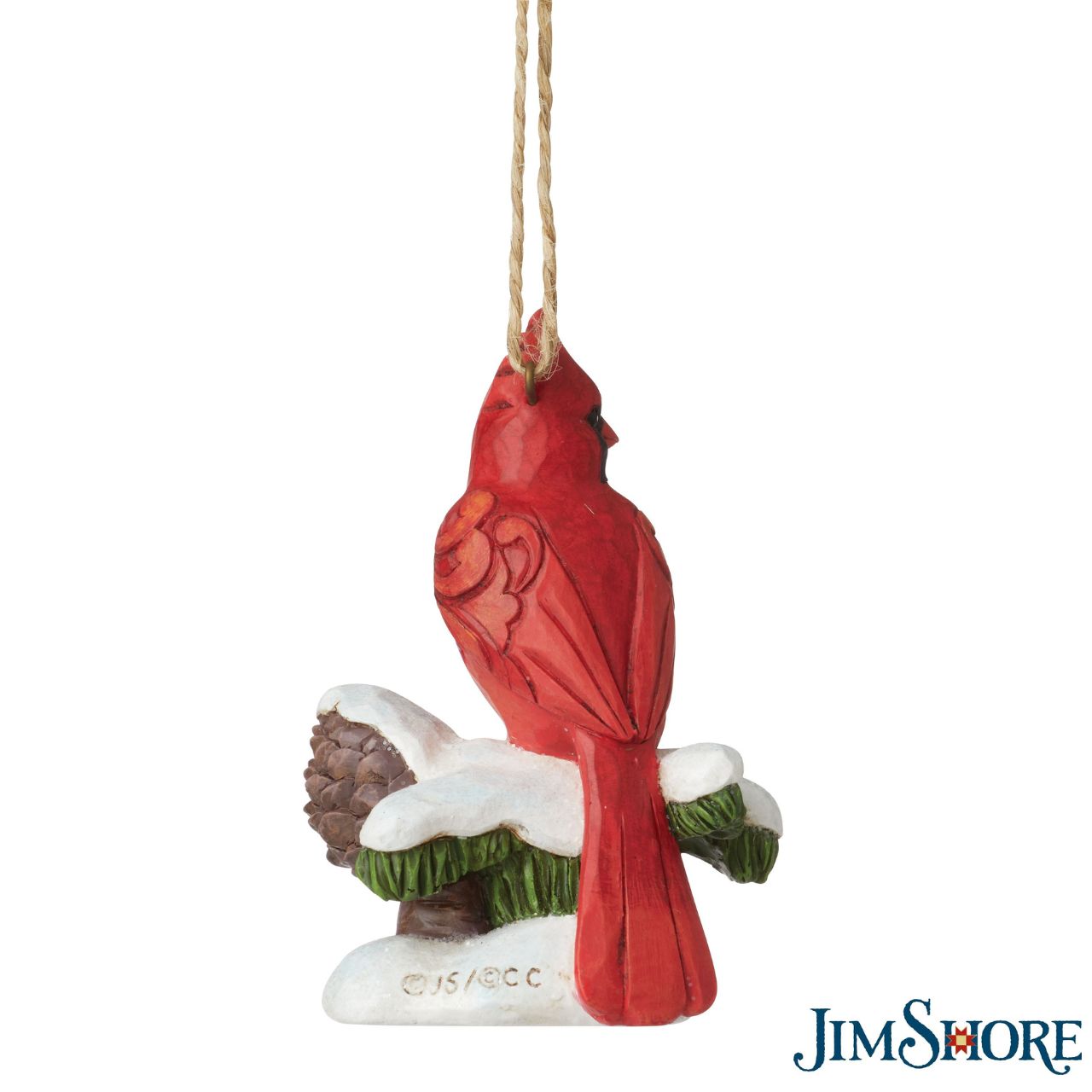 Carving Cardinal Hanging Ornament by Jim Shore  Celebrate Christmas with this beautiful hand crafted and hand painted Carving Cardinal on Snowy Branch Hanging Ornament. Decorate your tree this Christmas with this Carving Cardinal on Snowy Branch Hanging Ornament.