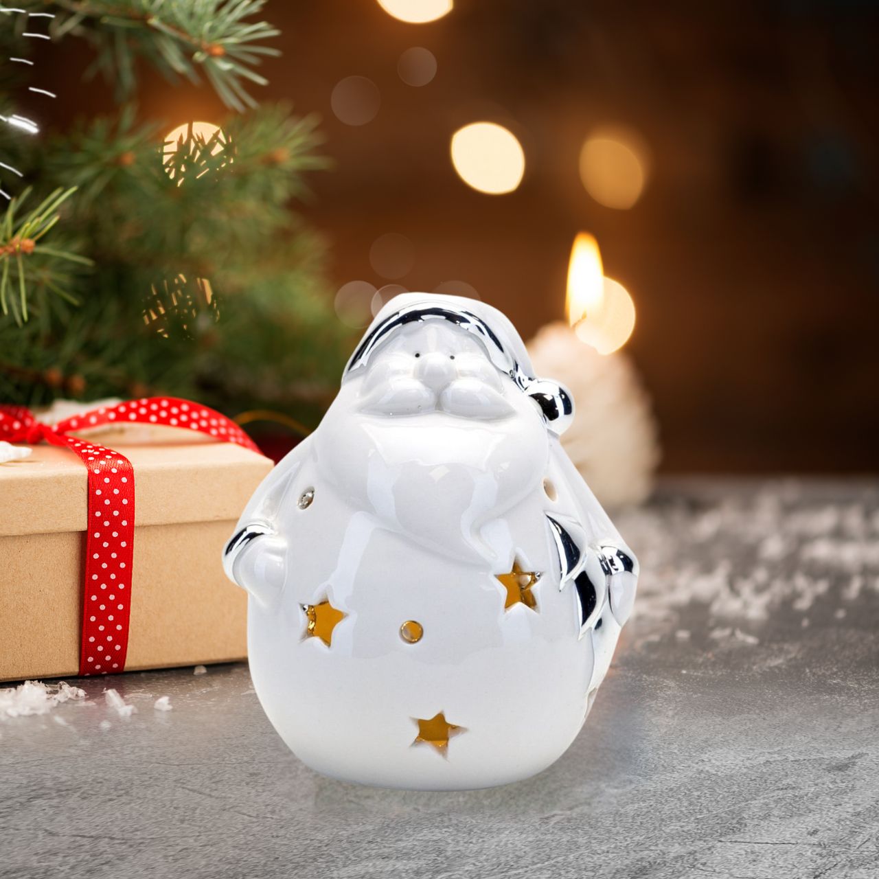 This plump ceramic Santa mould features a shiny white finish, complete with matching silver detail and cut out shapes. Inside sits a series of LED lights that produce a warm yellow glow to safely light up living spaces in the evening.