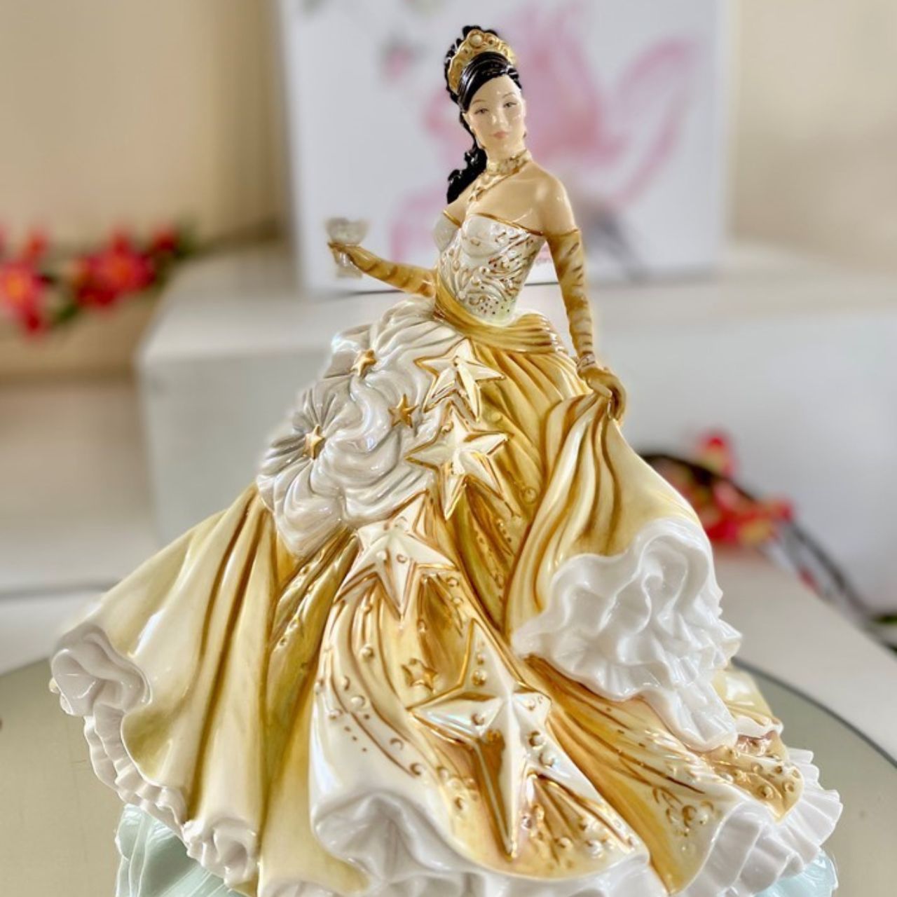 English Ladies Congratulations Gold  Our Congratulations Gold figurine is one of our best sellers from the English Ladies Congratulations Collection. This is an amazing fine bone china figurine, designed by renowned modeller Valerie Annand and Master Painter Dan Smith, for our Congratulations figurines range.