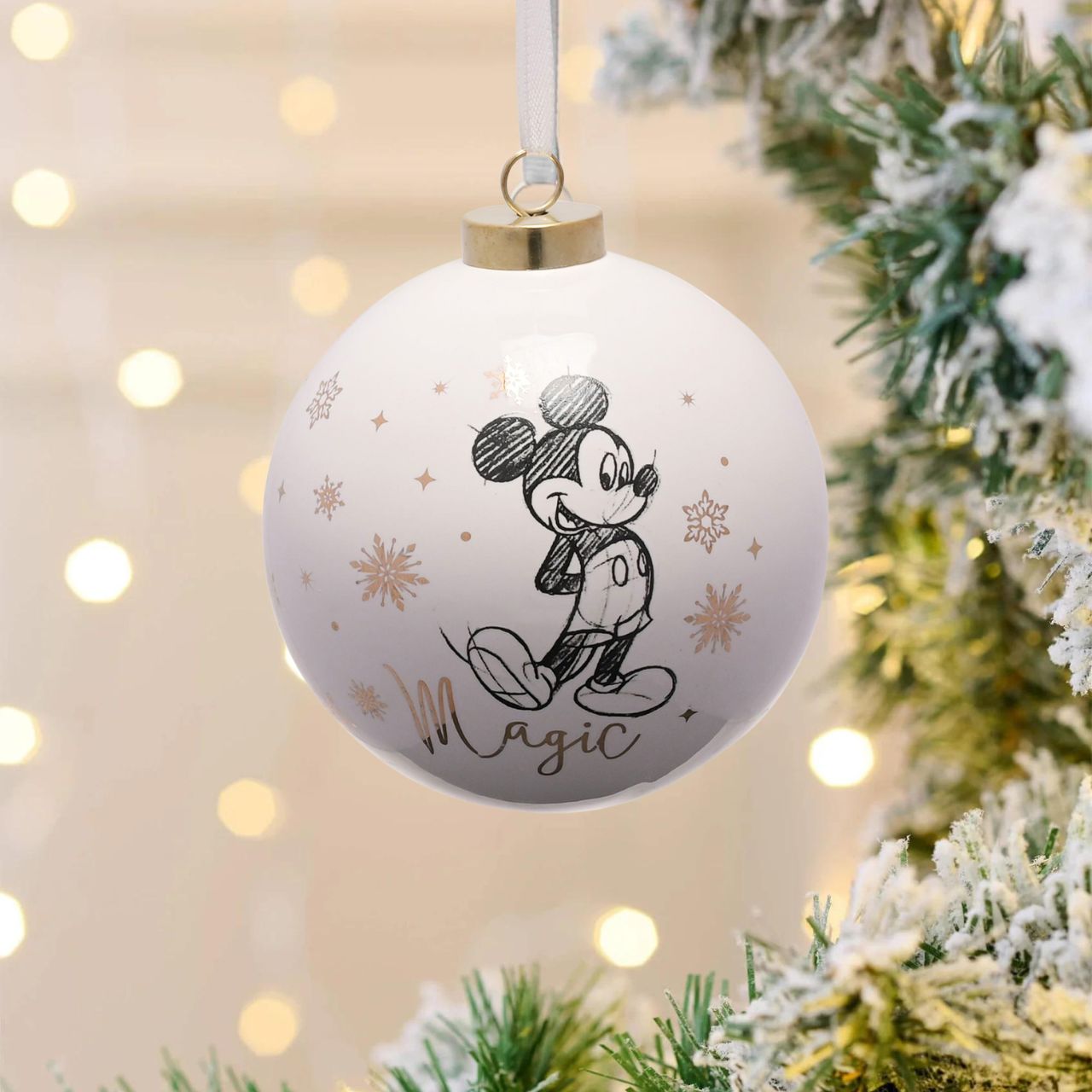 Disney Ceramic Christmas Bauble Mickey  Bring touch of timeless Disney magic to the Christmas tree with this elegant gold foiled ceramic collectable Mickey Mouse bauble. From Disney Classic Collectables - luxurious collectable gifts for the enduring Disney fan.