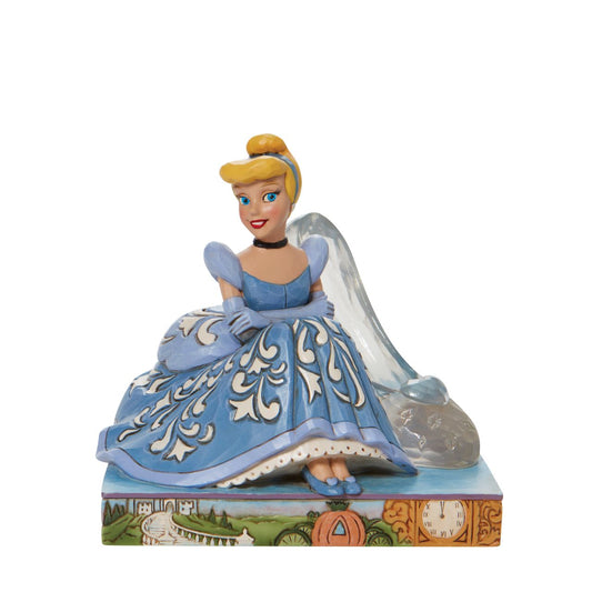 This Disney Traditions line by Jim Shore features iconic Walt Disney princesses with their famous props highlighted. With a base illustrating her story, this piece features Cinderella in her brilliant blue gown with a glass slipper.