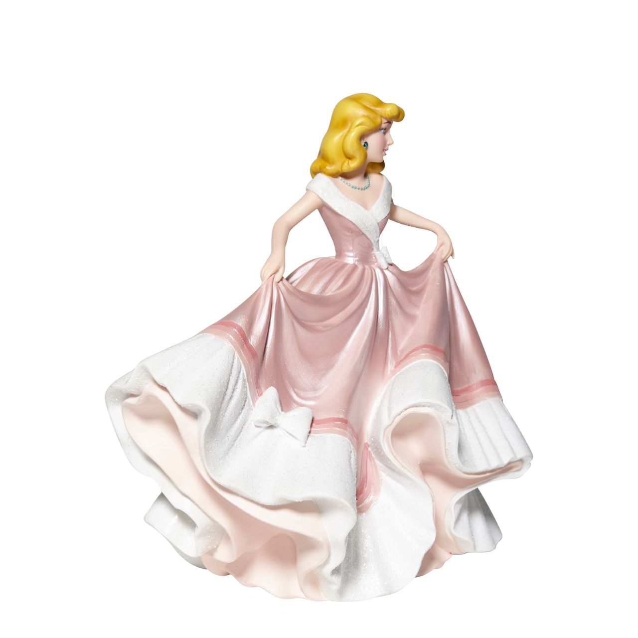 Cinderella in Pink Dress Couture de Force Figurine  Disney Couture de Force celebrates the 70th Anniversary of Cinderella. She is captured here in her classic pink gown of "what might have been." With the help of her mice tailors, the dress shimmers with satin finishes, iridescent glitter and jewels. Supplied in branded gift box.