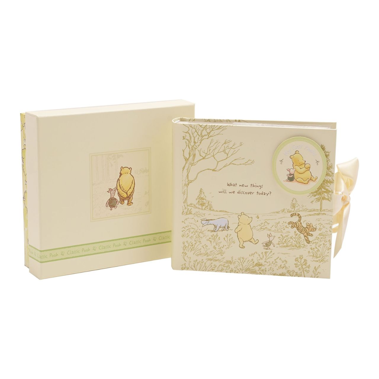 Disney Classic Pooh Heritage Photo Album Box My First Photos  This Winnie the Pooh keepsake photo album has been designed to reflect E.H. Shepard's original illustrations from the original A. A. Milne books, to be cherished for many years. Includes 80 photo sleeves.