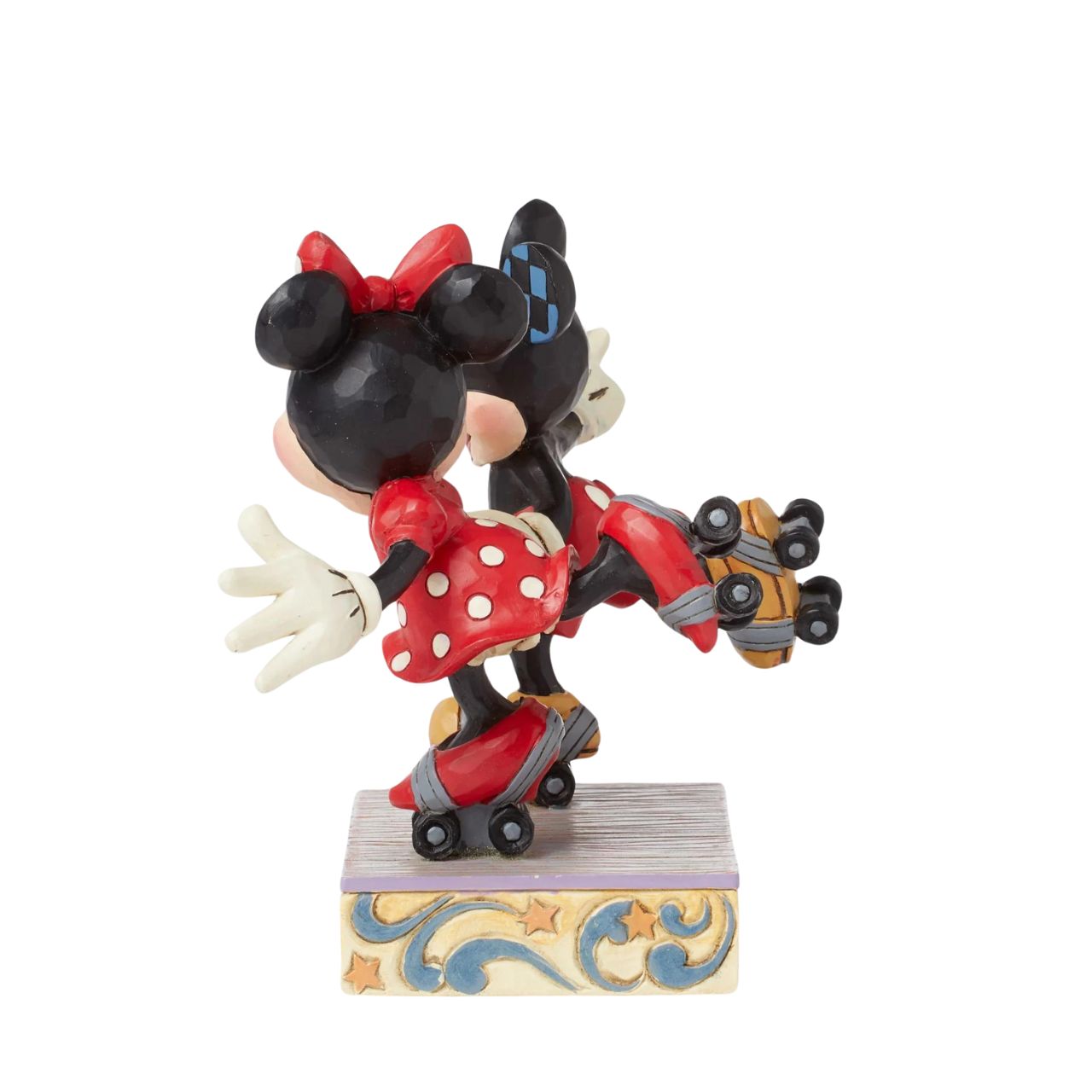 Introducing the newest addition to the Disney Traditions collection by Jim Shore - the Mickey and Minnie Mouse Roller Skating figurine] With exquisite attention to detail and impeccable craftsmanship, this high-quality piece is a must-have for any Disney fan and collector. Mickey and Minnie Mouse are arguably the most iconic couple in the Disney universe, and this figurine captures them in their element - roller skating together hand in hand.