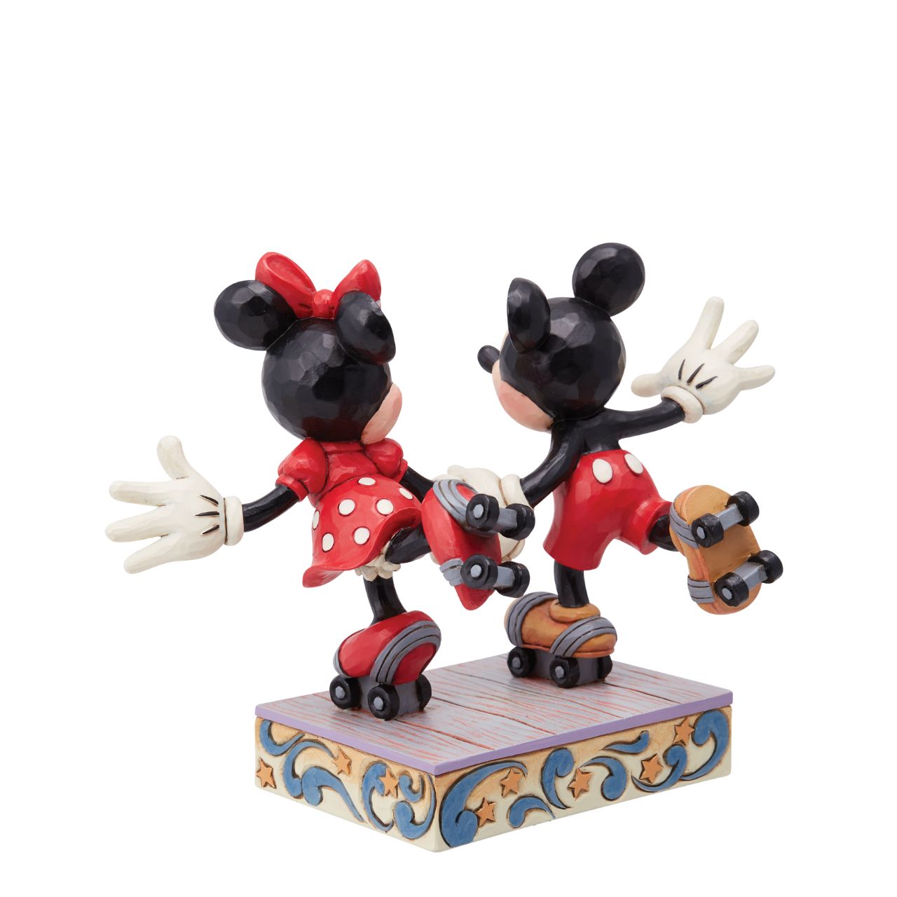 Introducing the newest addition to the Disney Traditions collection by Jim Shore - the Mickey and Minnie Mouse Roller Skating figurine] With exquisite attention to detail and impeccable craftsmanship, this high-quality piece is a must-have for any Disney fan and collector. Mickey and Minnie Mouse are arguably the most iconic couple in the Disney universe, and this figurine captures them in their element - roller skating together hand in hand.