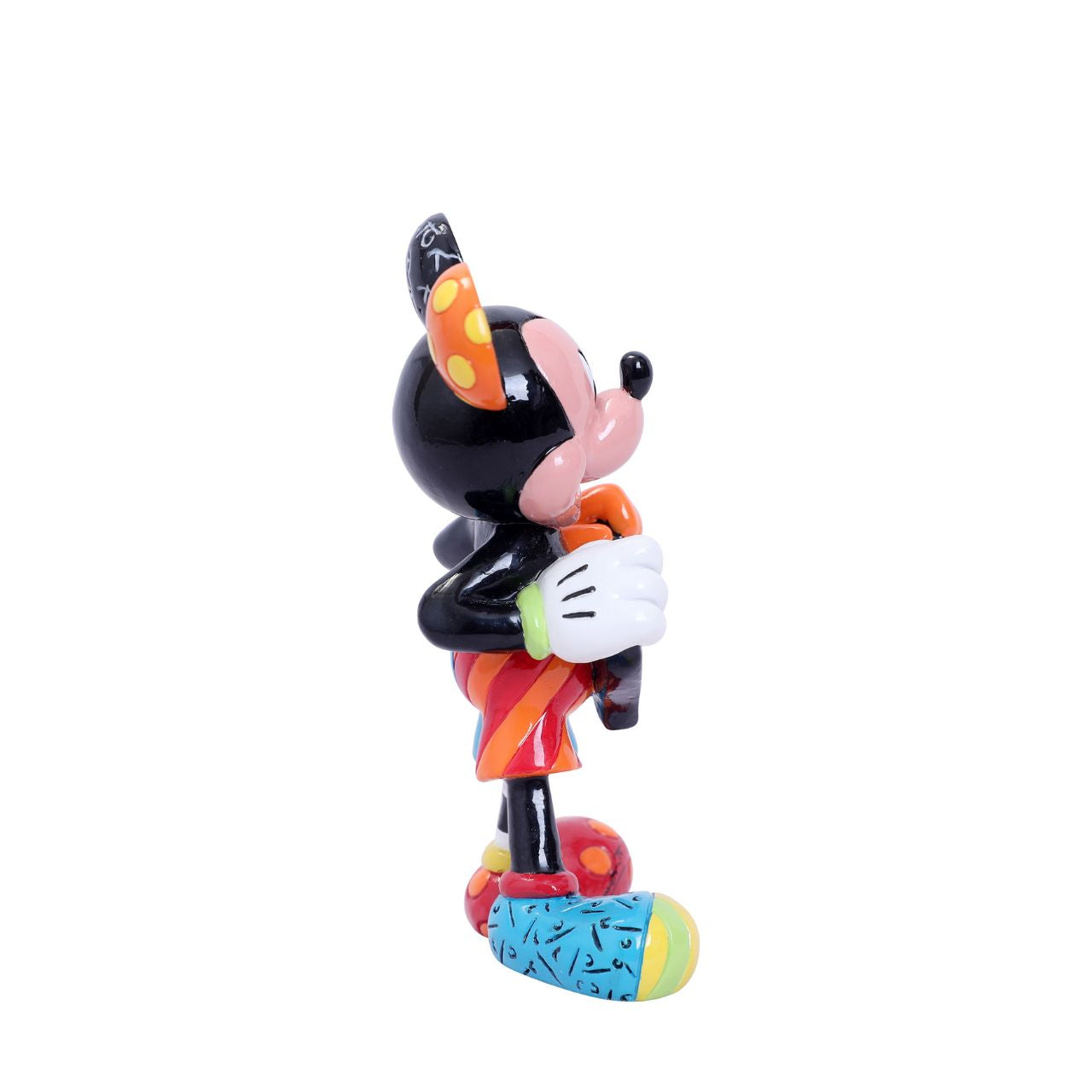 With a joyful smile, Mickey holds out a brightly painted heart to his beloved Minnie. Mickey is rocking a gloriously diverse palette, thanks to a unique paint job by Romero Britto, a multi-talented Brazilian pop artist known for his vibrant colours.