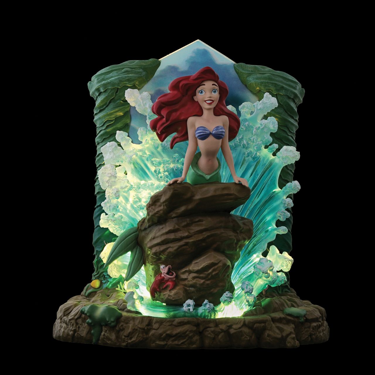 The Little Mermaid light up figurine. The figurine is made from cast stone. Each piece is hand painted and slight colour variations are to be expected which makes each piece unique. Supplied in branded gift box. 