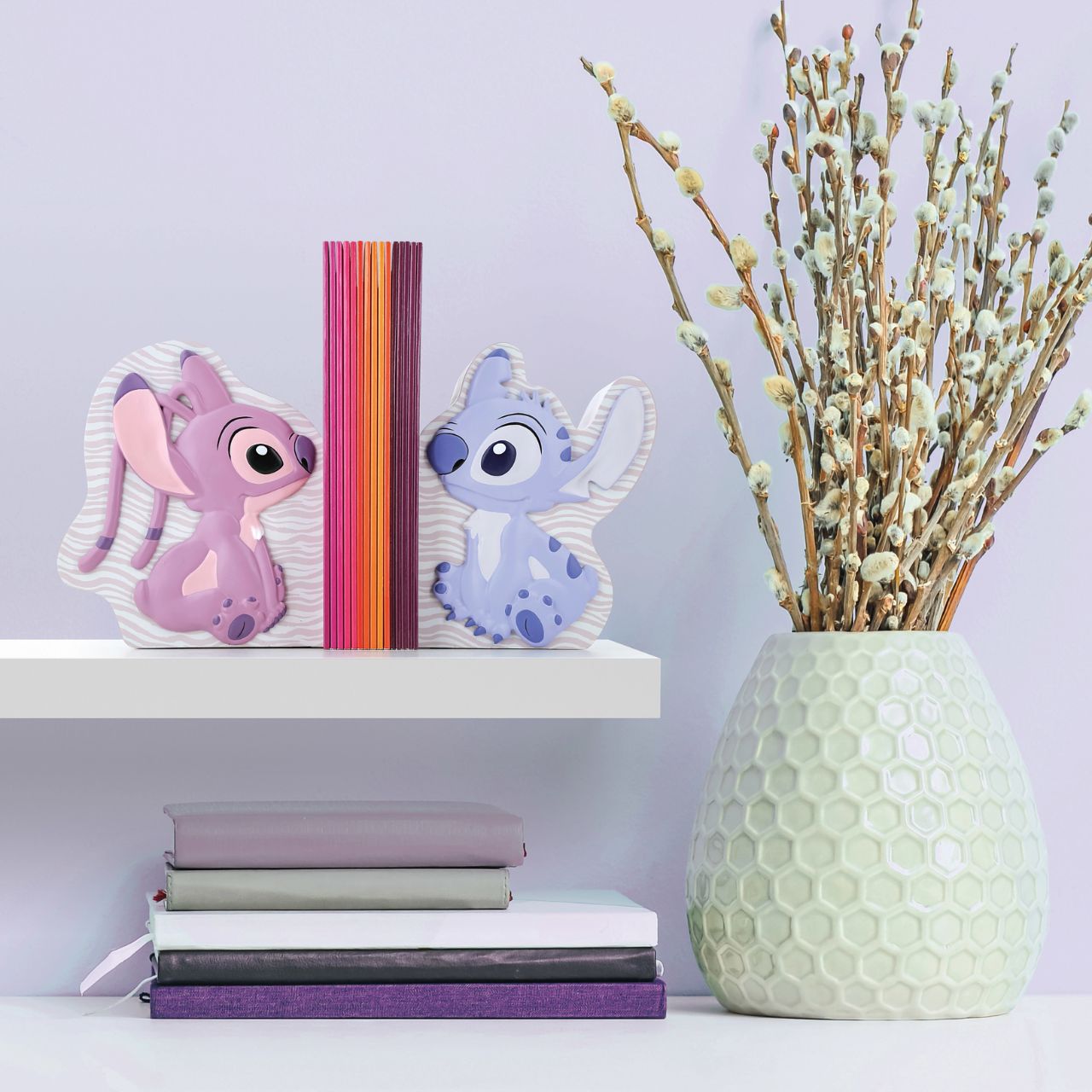 Let Stitch and Angel guard your tales. Introducing Disney's Stitch and Angel Bookends. These adorable characters create a delightful scene while showcasing your favourite stories. Add a touch of mischief and love to your shelves with these charming bookends.