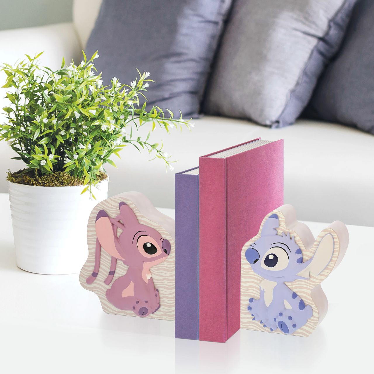 Let Stitch and Angel guard your tales. Introducing Disney's Stitch and Angel Bookends. These adorable characters create a delightful scene while showcasing your favourite stories. Add a touch of mischief and love to your shelves with these charming bookends.