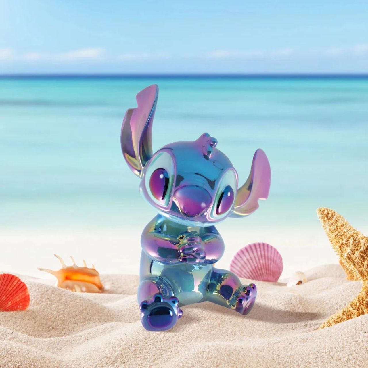 Make saving fun with the Stitch Ceramic Money Bank by Disney Showcase. It is the perfect, practical décor piece for Disney fans of all ages. At 19 cm tall with a dazzling blue, iridescent finish this piece is guaranteed to catch the attention of all that see it and will add the Disney magic to any home.