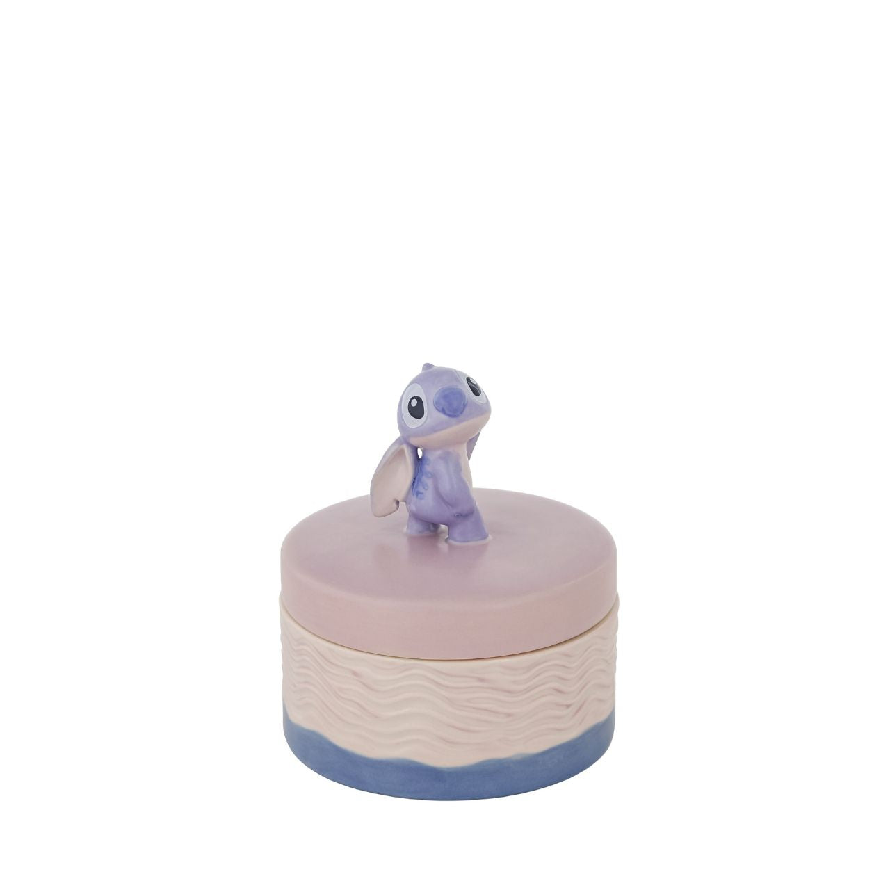 Discover magic within the Disney Stitch Keepsake Box. Adorned with a charming Stitch figurine handle, this whimsical box holds treasures while bringing joy to any space. Embrace nostalgia and keep your special mementos close with this delightful addition to your collection.