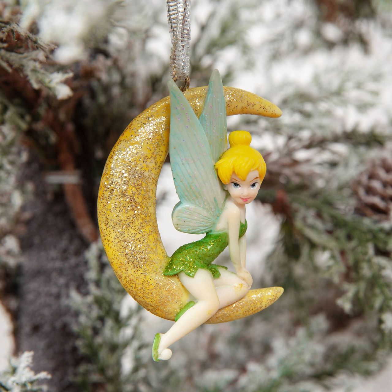 Bring some of that Disney sparkle to the tree with this shimmering hand painted Tinkerbell tree decoration.