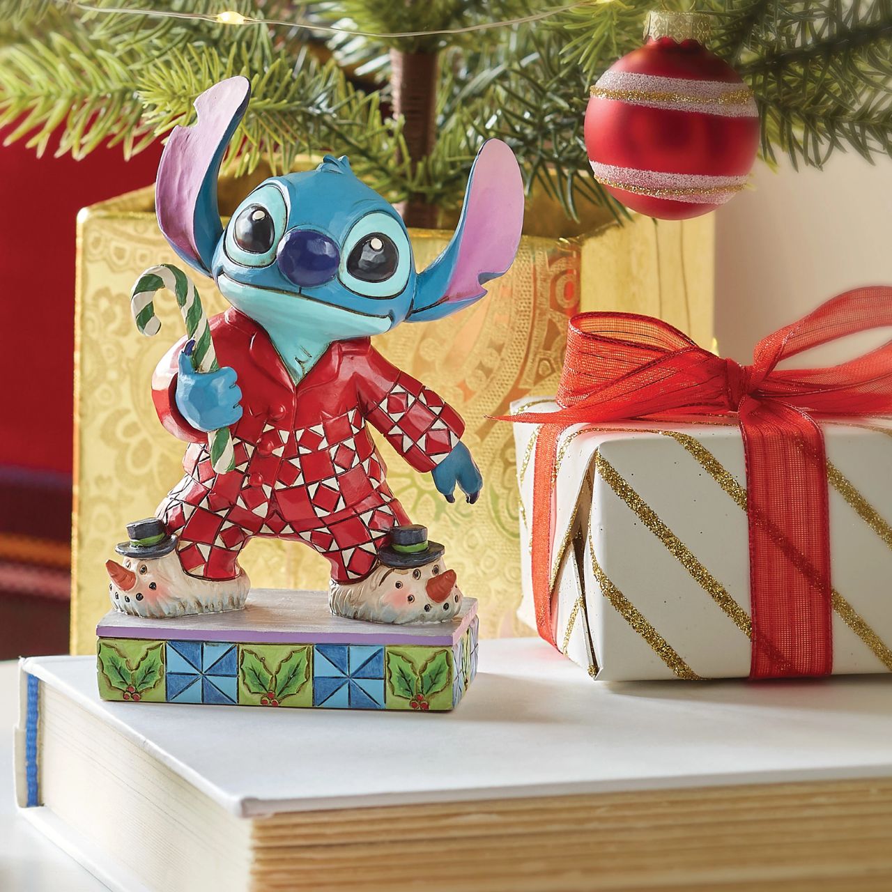 Stitch is ready for Christmas morning with his festive pjs - we wonder if Santa has visited him. Comes in a fully branded gift box from Disney Traditions.