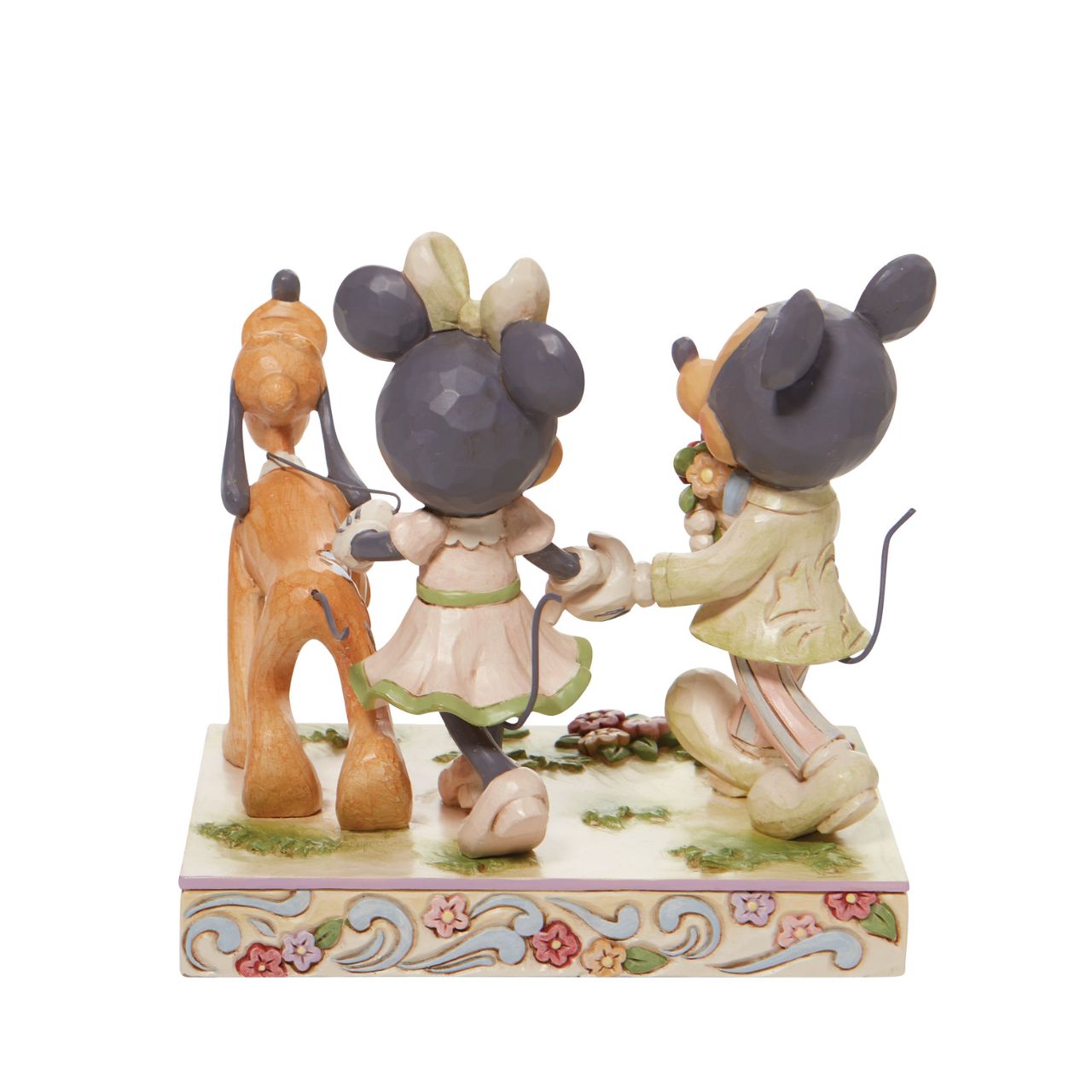 Walt Disney's original couple, Mickey and Minnie Mouse, stroll through the park hand in hand in this lovely Jim Shore piece. With love in the spring air, Mickey hands his wife a bouquet of fresh flowers as their playful pup, Pluto, amuses himself.