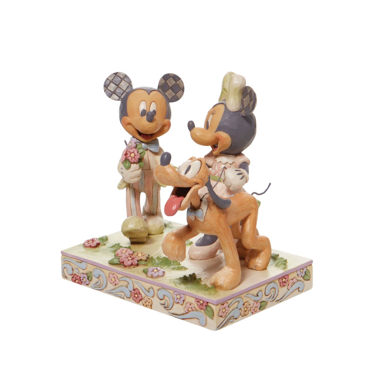 Walt Disney's original couple, Mickey and Minnie Mouse, stroll through the park hand in hand in this lovely Jim Shore piece. With love in the spring air, Mickey hands his wife a bouquet of fresh flowers as their playful pup, Pluto, amuses himself.