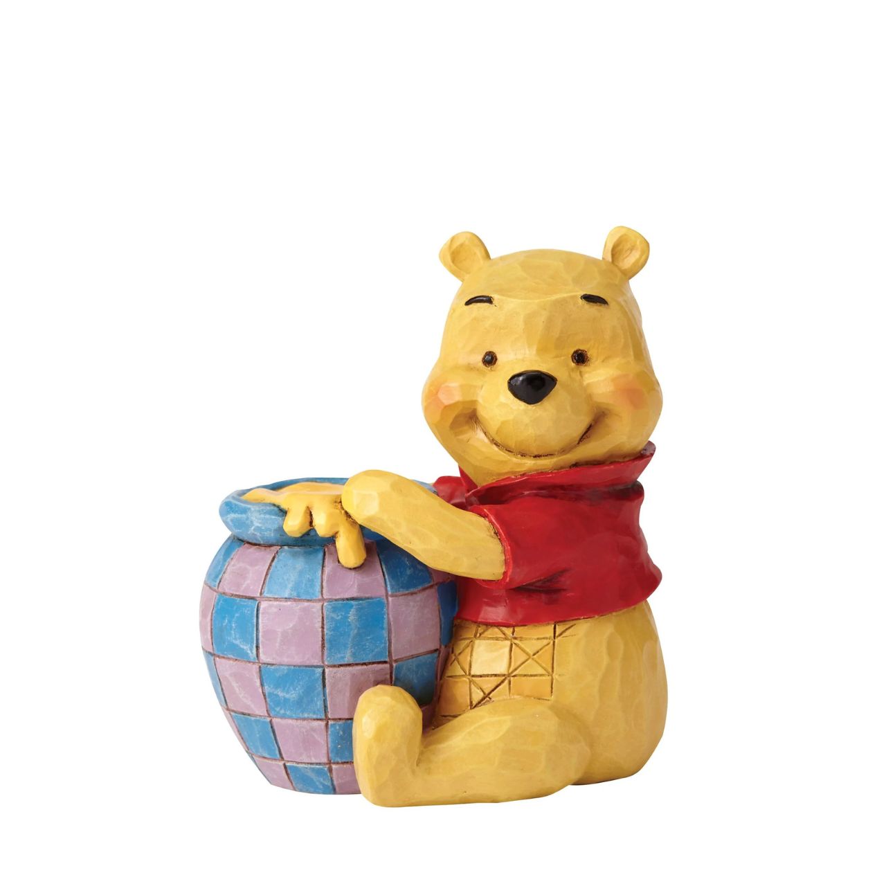 Beautifully handcrafted with delightful attention to detail, Jim Shore's charming miniatures capture the essence of the beloved Disney characters. A smiling Winnie the Pooh hugs his jar of honey in this classic moment inspired by the classic film.