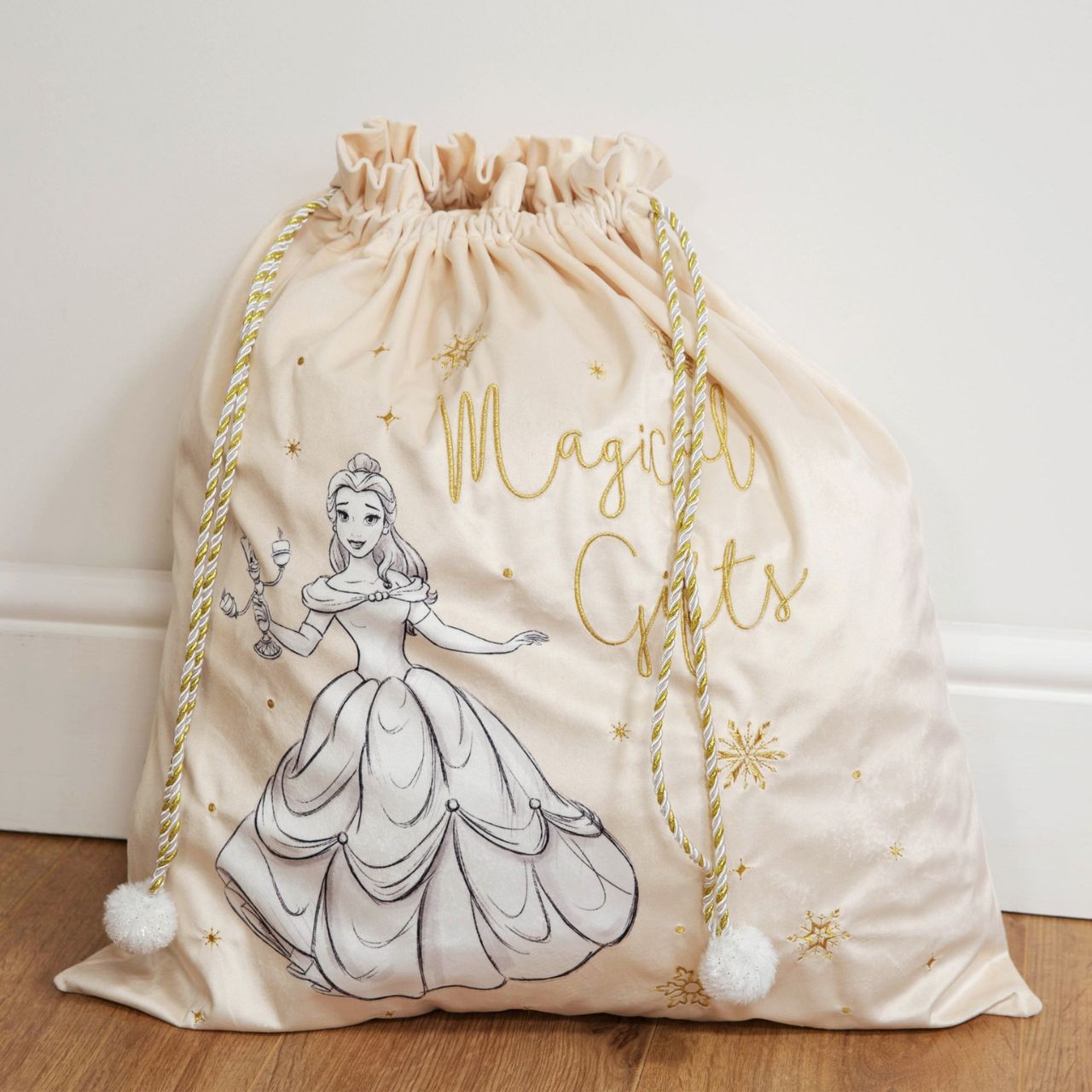 Give Santa the perfect place to leave those gifts with this beautiful cream velveteen Beauty &amp; The Beast gift sack with gold embroidery. From Disney Classic Collectables - luxurious collectable gifts for the enduring Disney fan.