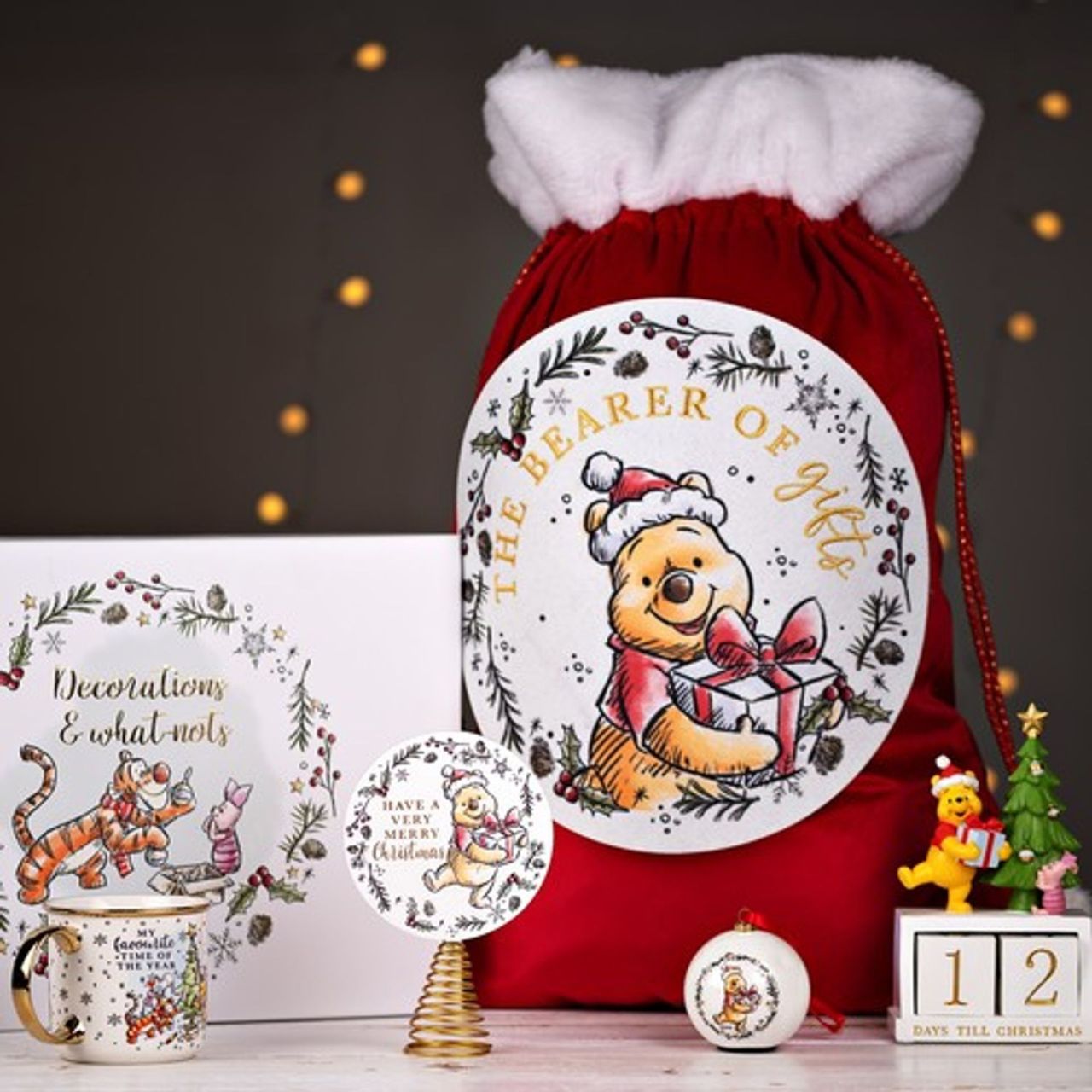 Disney Winnie Christmas Storage Box  Store your favourite decorations in this delightful Winnie the Pooh storage box. With adorable illustrations, this is a great place to keep things safe over the Christmas season.