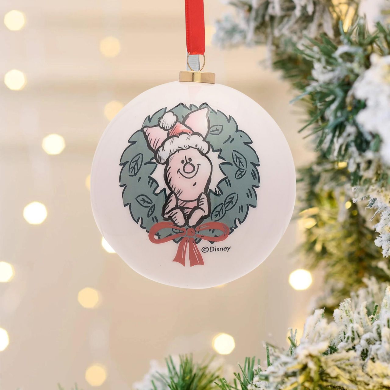 Disney Winnie the Pooh Set of 12 Christmas Baubles  A set of 12 Winnie the Pooh baubles by DISNEY.  These fun-filled decorations will hang proudly and brightly from the Christmas tree throughout December.