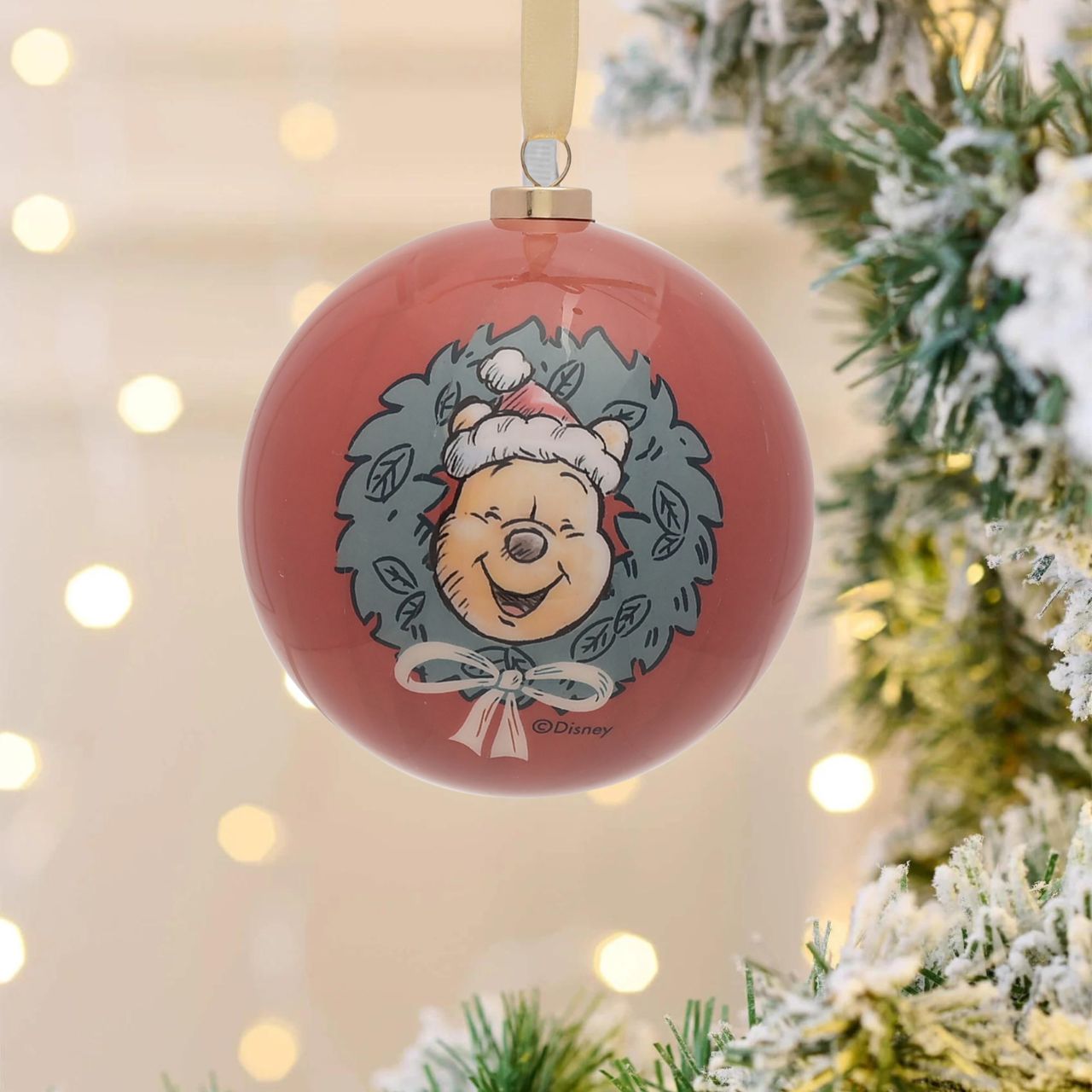 Disney Winnie the Pooh Set of 12 Christmas Baubles  A set of 12 Winnie the Pooh baubles by DISNEY.  These fun-filled decorations will hang proudly and brightly from the Christmas tree throughout December.