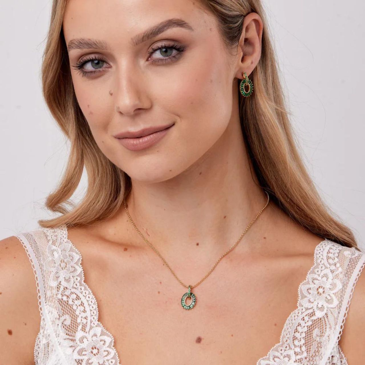 Emerald Baguette Earrings by Knight & Day  Knight & Day's Emerald Baguette Earrings showcase an exquisite combination of green emerald CZ stones. The earrings add a breath-taking touch of elegance to any outfit. Stunning yet subtle, these earrings make an eye-catching accessorizing choice.