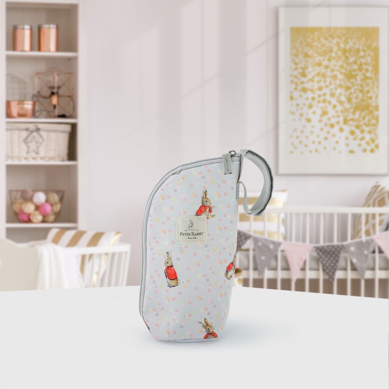 Our portable classic Flopsy insulated bottle bag makes feeding on the go easy. Can be used to keep bottles hot or cold so ideal for your hungry little rabbit. The adorable design ensures it fits perfectly on your wrist, pram, or bag.