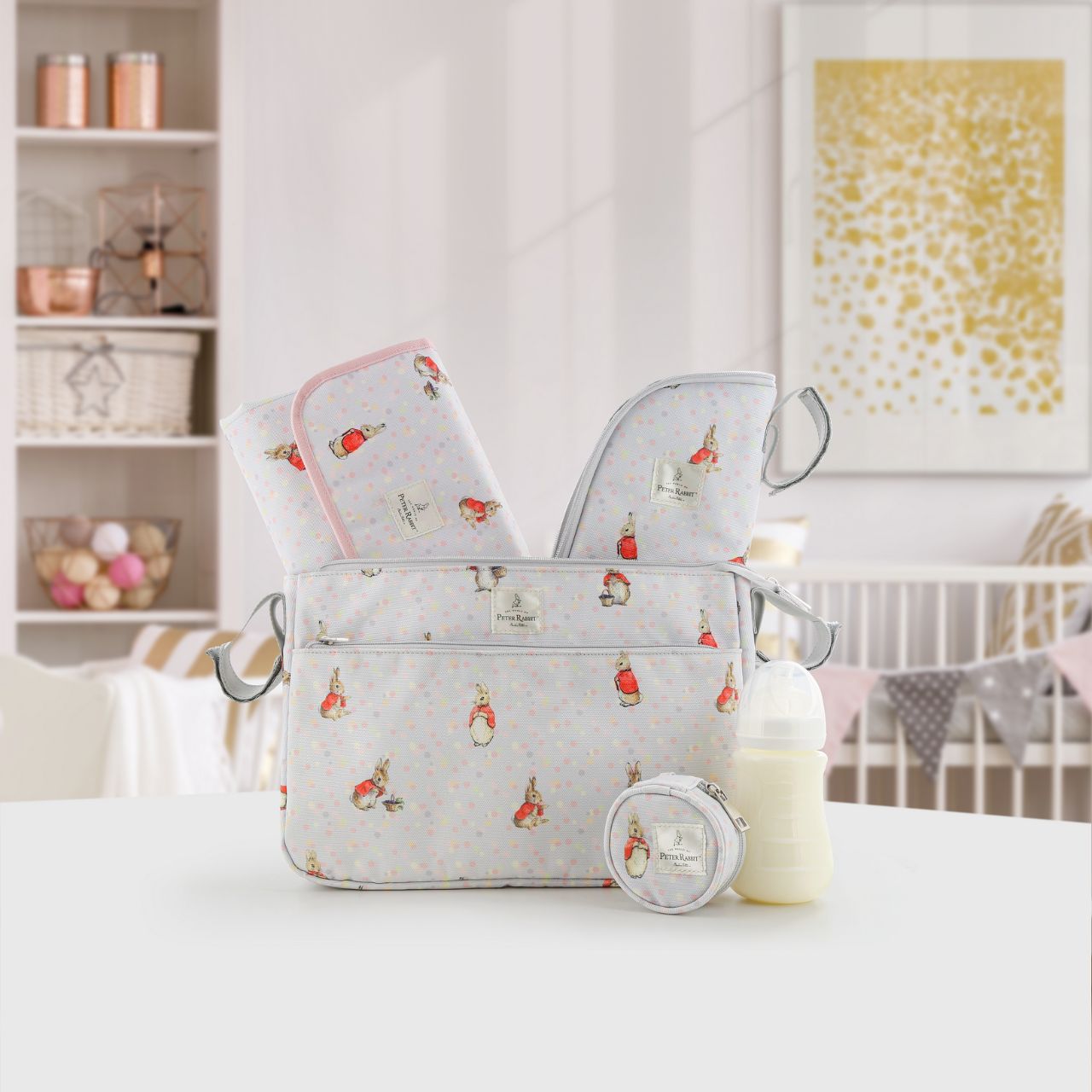 This Flopsy pram organiser will keep all your essentials and valuables close at hand when you are out and about with your little one. This functional and fashionable bag easily attaches to your pram with the Velcro side straps - perfect for quick trips out and about. Featuring Flopsy on an easily wipe-down PU fabric, off-set against pastel splashes of colour on a cool grey background makes this the perfect baby shower gift for any parents-to-be.