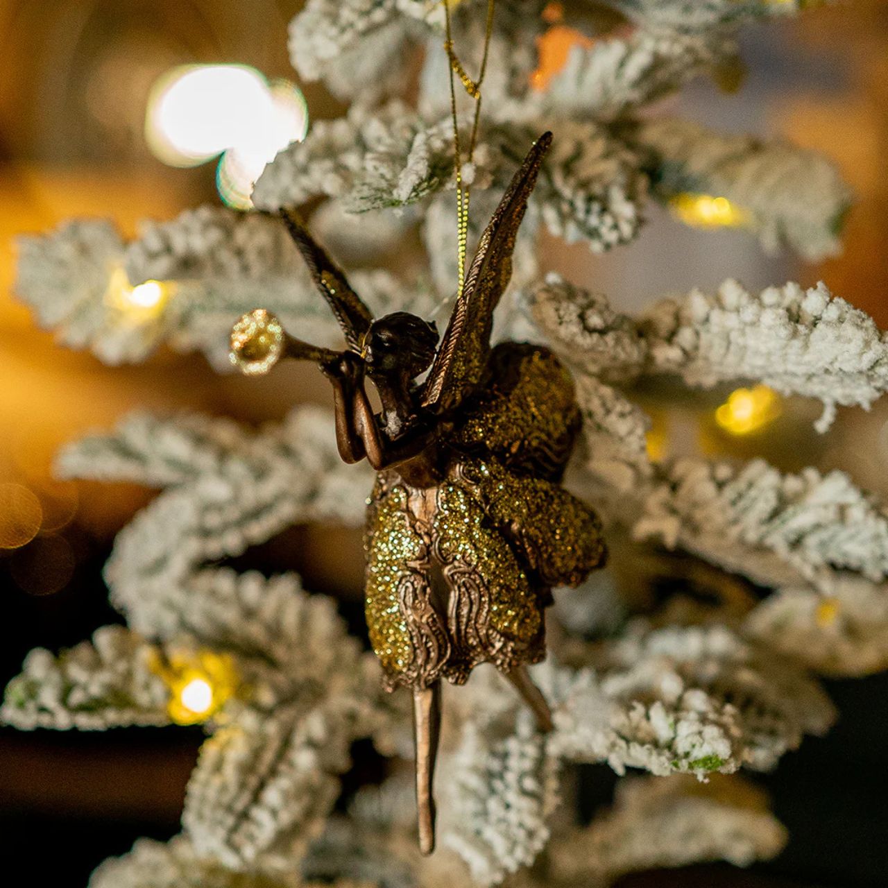 Add a touch of magic to your home with our Genesis Ballerina Tree Ornament. Each ornament features a graceful ballet dancer adorned with delicate wings, combining elegance and charm.