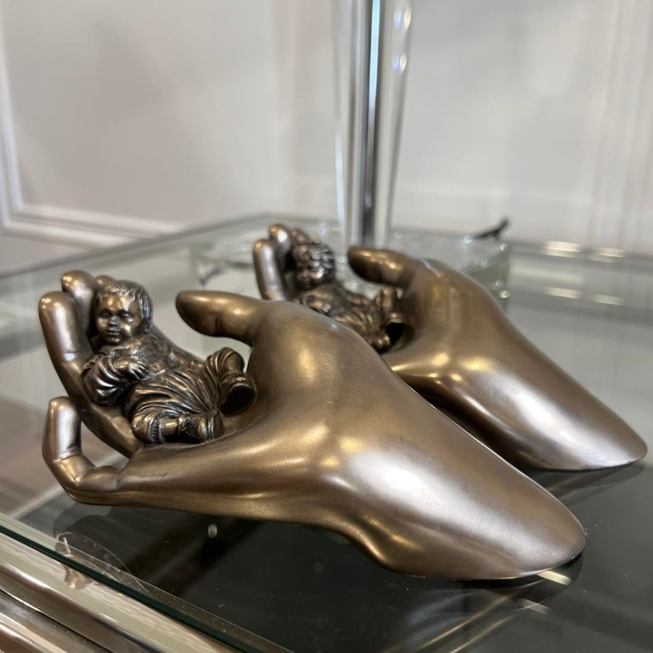 Beautifully crafted in cold cast bronze this wonderful baby figurine from the craftsmen of Genesis Fine Arts depicts the sleeping baby boy carefully curled up in a mothers caring hand.