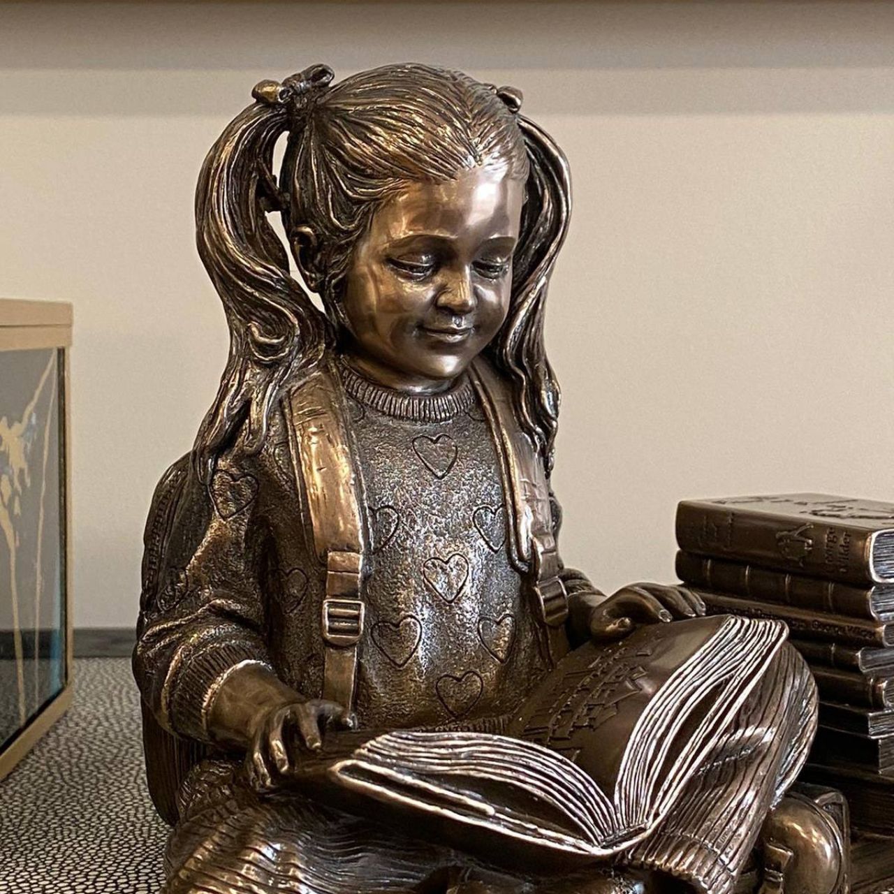 This captivating sculpture embodies the beauty of quiet reflection and the joy found within the pages of literature. It resonates with a sense of curiosity and intellectual curiosity, inviting one to delve into the realms of imagination and knowledge.