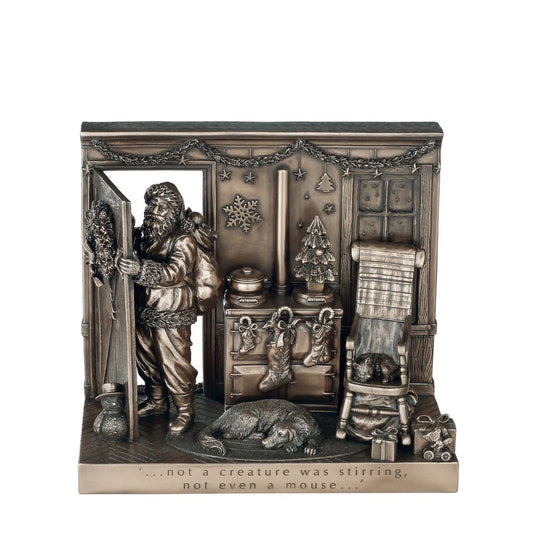 Beautifully crafted in cold cast bronze, this Christmas scene incorporates Father Christmas and his bag of toys leaving the scene after filling the stockings for Christmas. The words 'Not a creature was stirring not even a mouse' crafted into the front of the scene this Christmas display would make a wonderful gift.