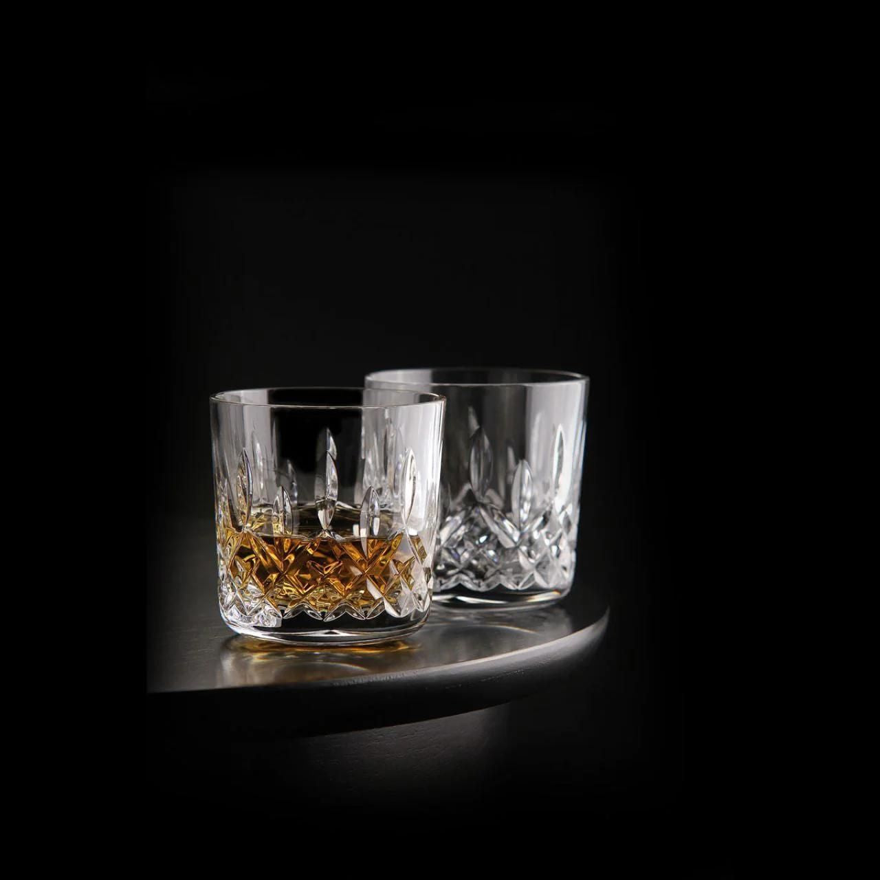 Giftology Lismore Tumbler Set of 2 by Waterford Crystal   Packaged as a pair and providing a timeless gift for whiskey lovers are these popular Lismore Tumblers. Beautifully embellished with our distinguished Lismore pattern, these classic crystal tumblers provide the perfect serve for whiskey, brandy or bourbon, elevating a casual tipple into a luxurious occasion. 
