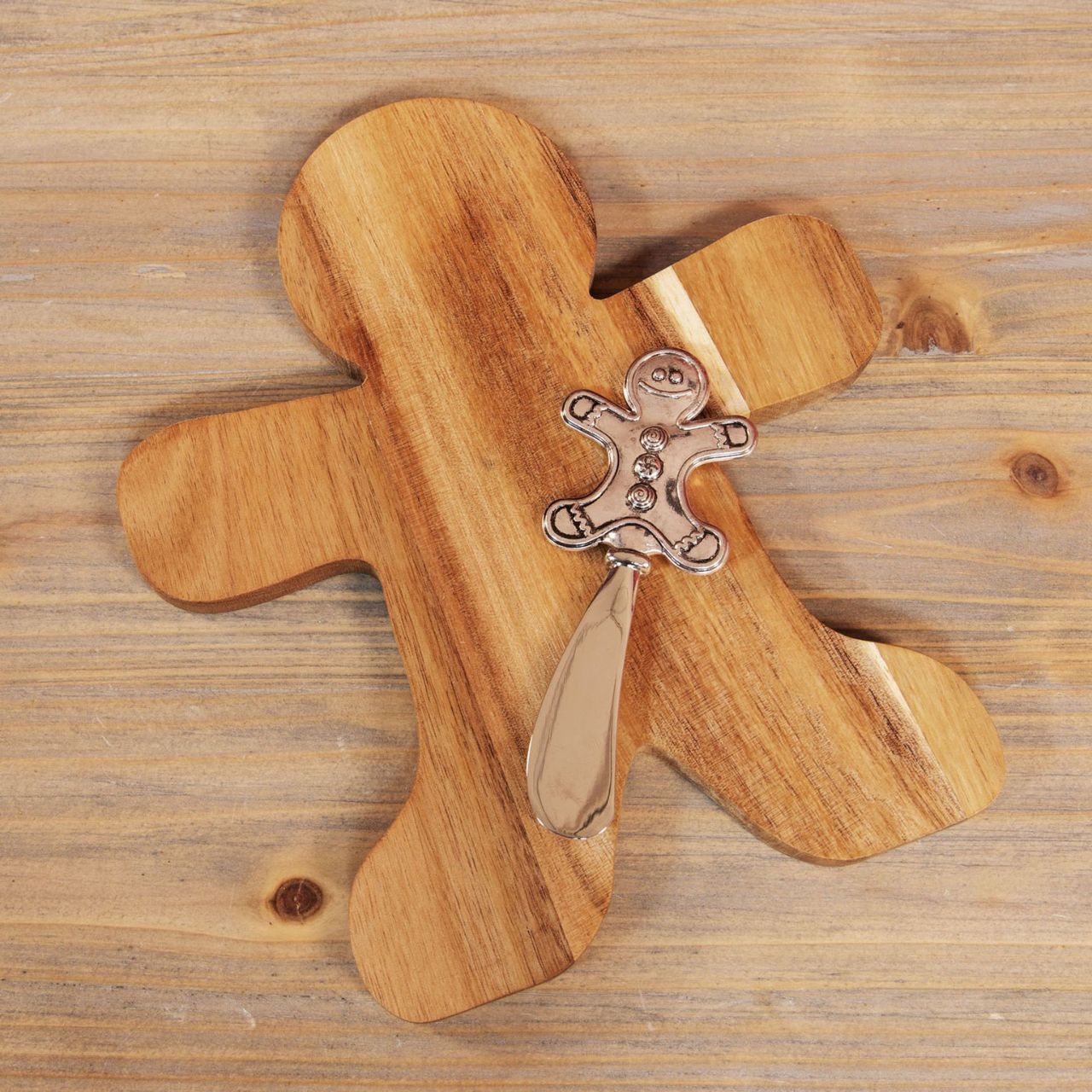 Add a touch of holiday spirit to your dining experience with this Wooden Gingerbread Man Cheeseboard &amp; Knife Red Bow.