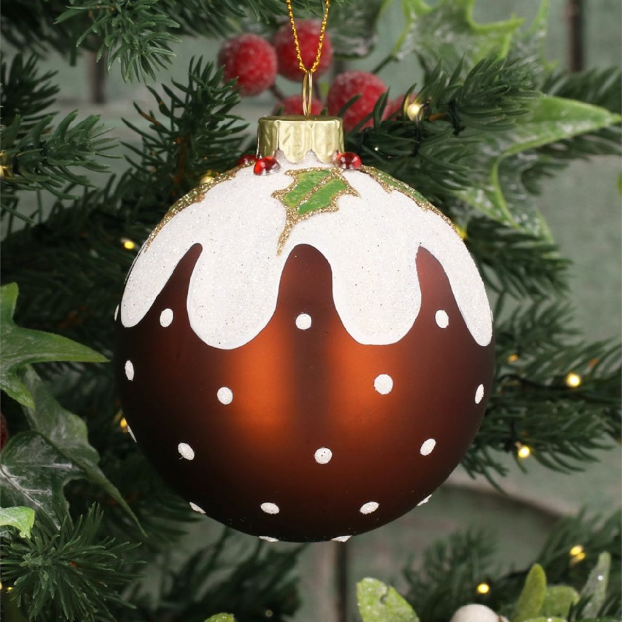 This 8cm Gisela Graham Christmas Baubles set features charming and festive Christmas Pudding designs. The perfect addition to your holiday décor, these baubles are sure to add a touch of warmth and nostalgia to your Christmas tree.