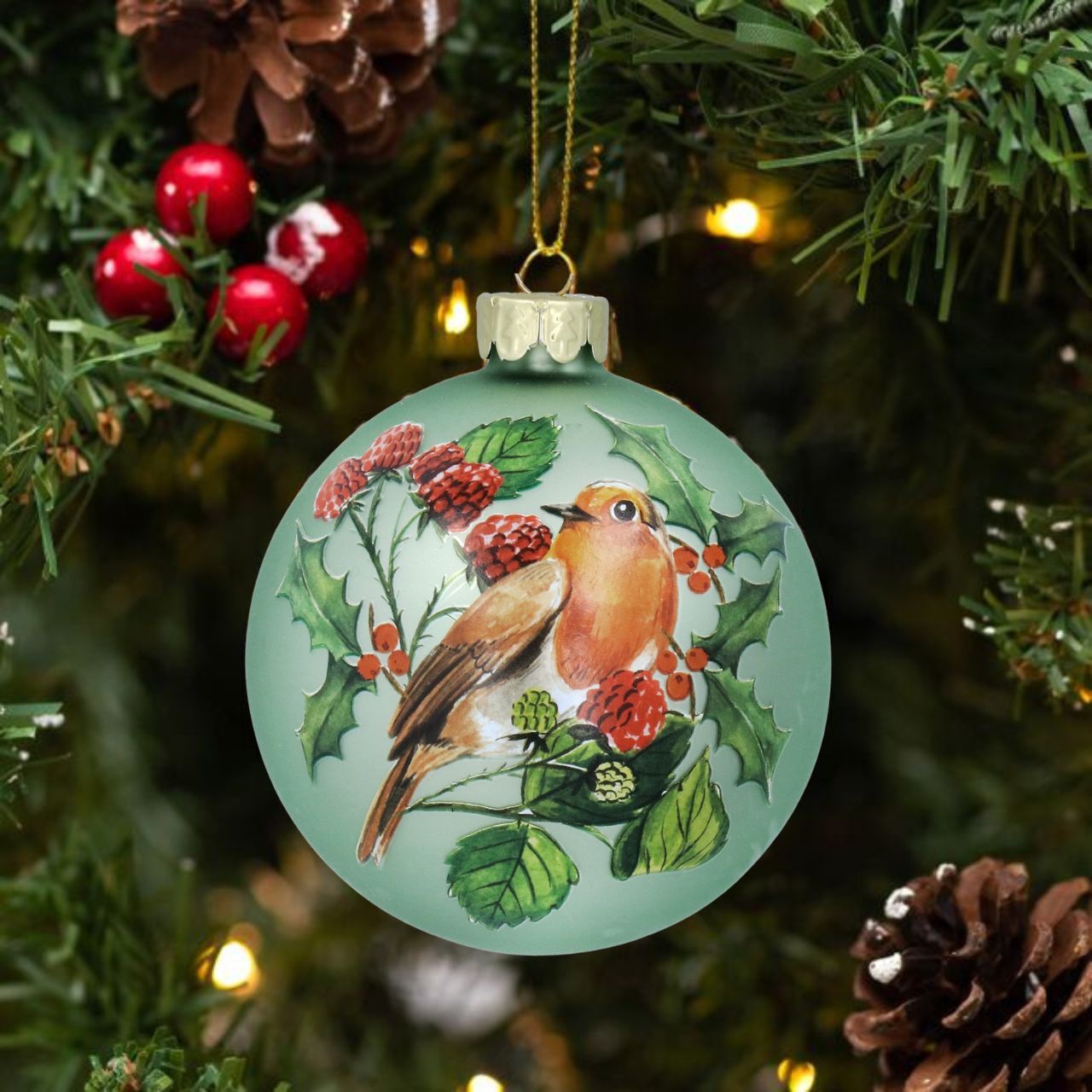 Add a touch of natural charm to your Christmas tree with these Gisela Graham Christmas Baubles. The matte pale green colour, adorned with a festive robin and fruit design, will bring a traditional and rustic feel to your holiday décor. Made with high-quality materials, these baubles are both durable and beautiful.