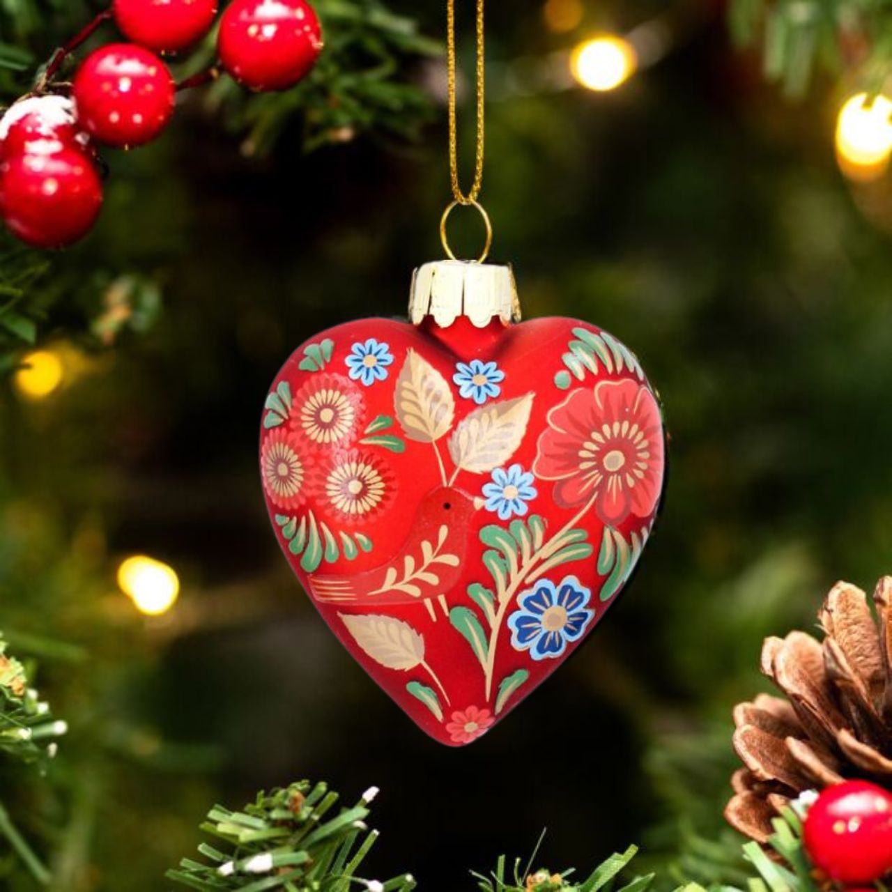 Graham  This Gisela Graham Folk Art Glass Heart Christmas Hanging Ornament will bring a lovely touch to your holiday décor. Made with high-quality glass, this ornament is sure to make a lasting impression. Perfect for adding a unique personal touch to your holiday decorations.