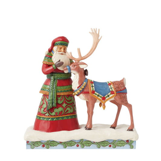 Hand painted and hand crafted from high quality cast stone, this figurine of Santa with his Reindeer helper is the perfect addition to any Christmas display. Part of the Heartwood Creek collection by Jim Shore. Comes in fully branded packaging.