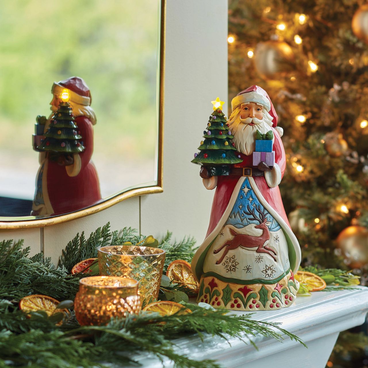 This impressive Santa figurine features a vintage style LED lit Christmas tree - perfect for any festive display. Batteries, not included. Part of the Heartwood Creek collection from Jim Shore. Comes in fully branded packaging.